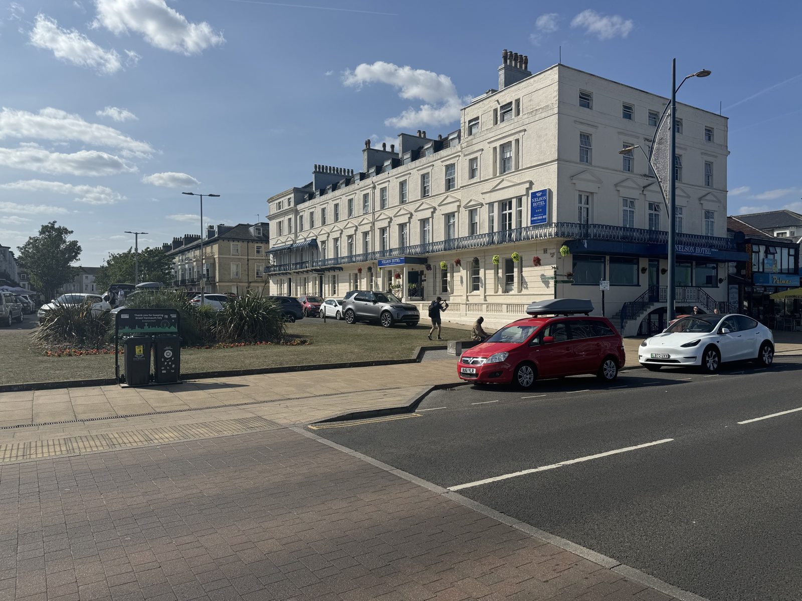 The white-fronted Nelson Hotel on the seafront in sunshine